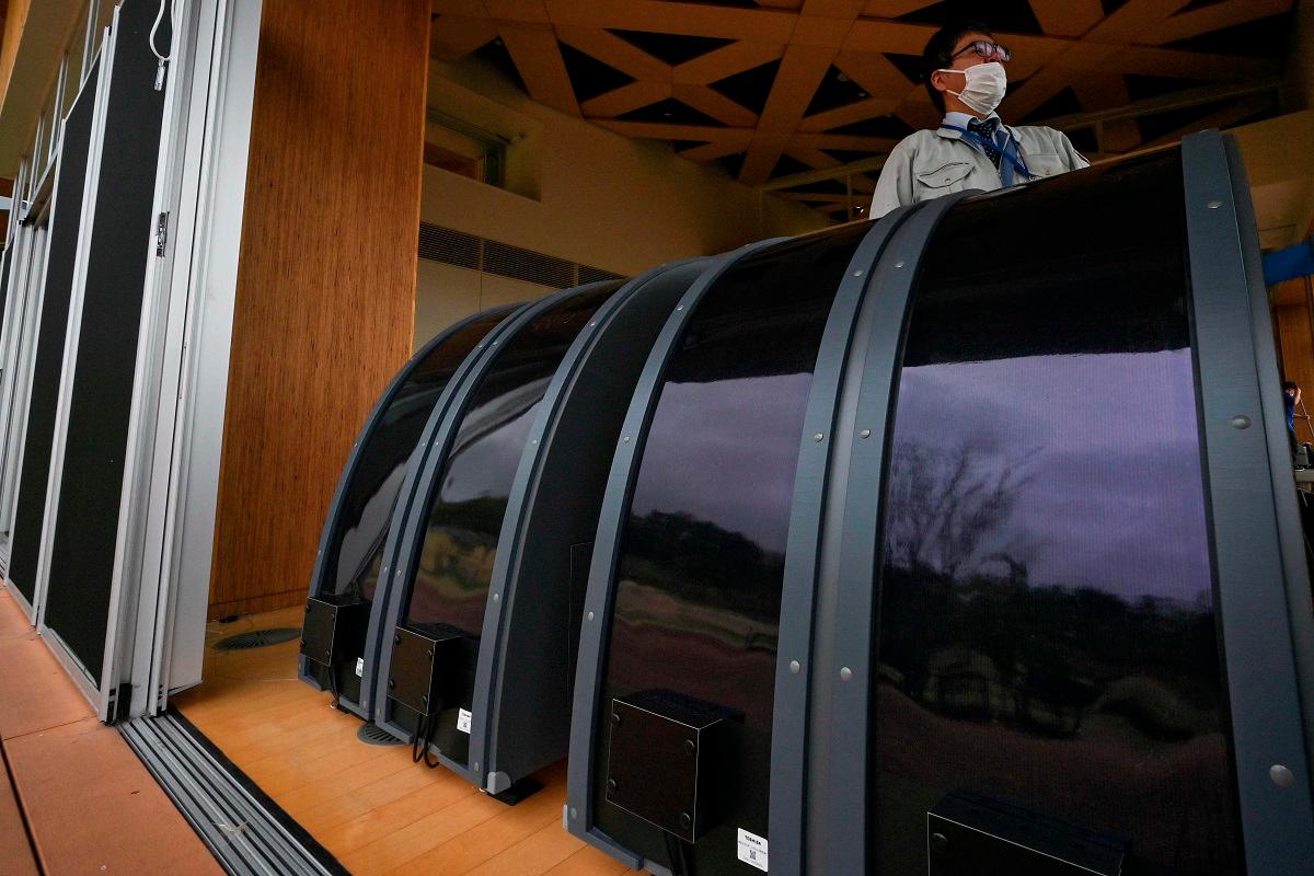 This photo taken on April 24, 2025 shows perovskite solar panels on display at the Okuma Town Hall in Okuma, Fukushima prefecture, an area of the town recently rebuilt just a few kilometres (miles) west of the stricken Fukushima Daiichi nuclear power plant. - AFP