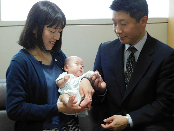 Six-month-old Ryusuke Sekiya (C) is pictured with his parents one day before his scheduled discharge from a hospital in Azumino, Nagano prefecture on April 19, 2019. — AFP
