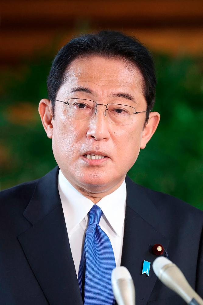 Japan's Prime Minister Fumio Kishida answers questions from reporters regarding the response to the Omicron Covid variant, at his office in Tokyo on November 29, 2021 as Japan will reinstate tough border measures. AFPpix