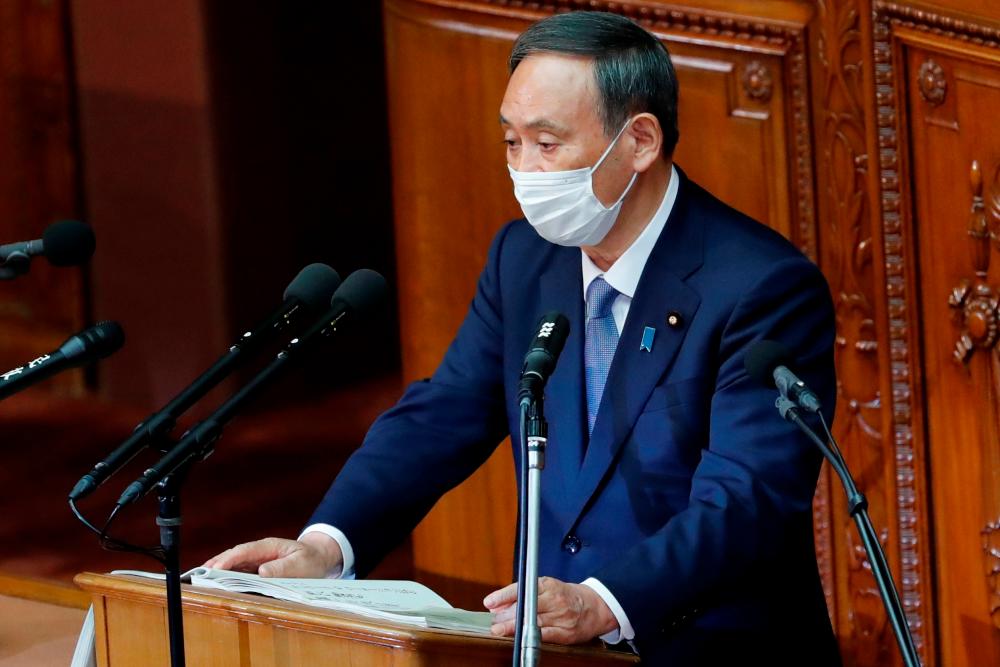 Japanese Prime Minister Yoshihide Suga gives his first policy speech in parliament as an extraordinary session opens in Tokyo, Japan October 26, 2020. — Reuters