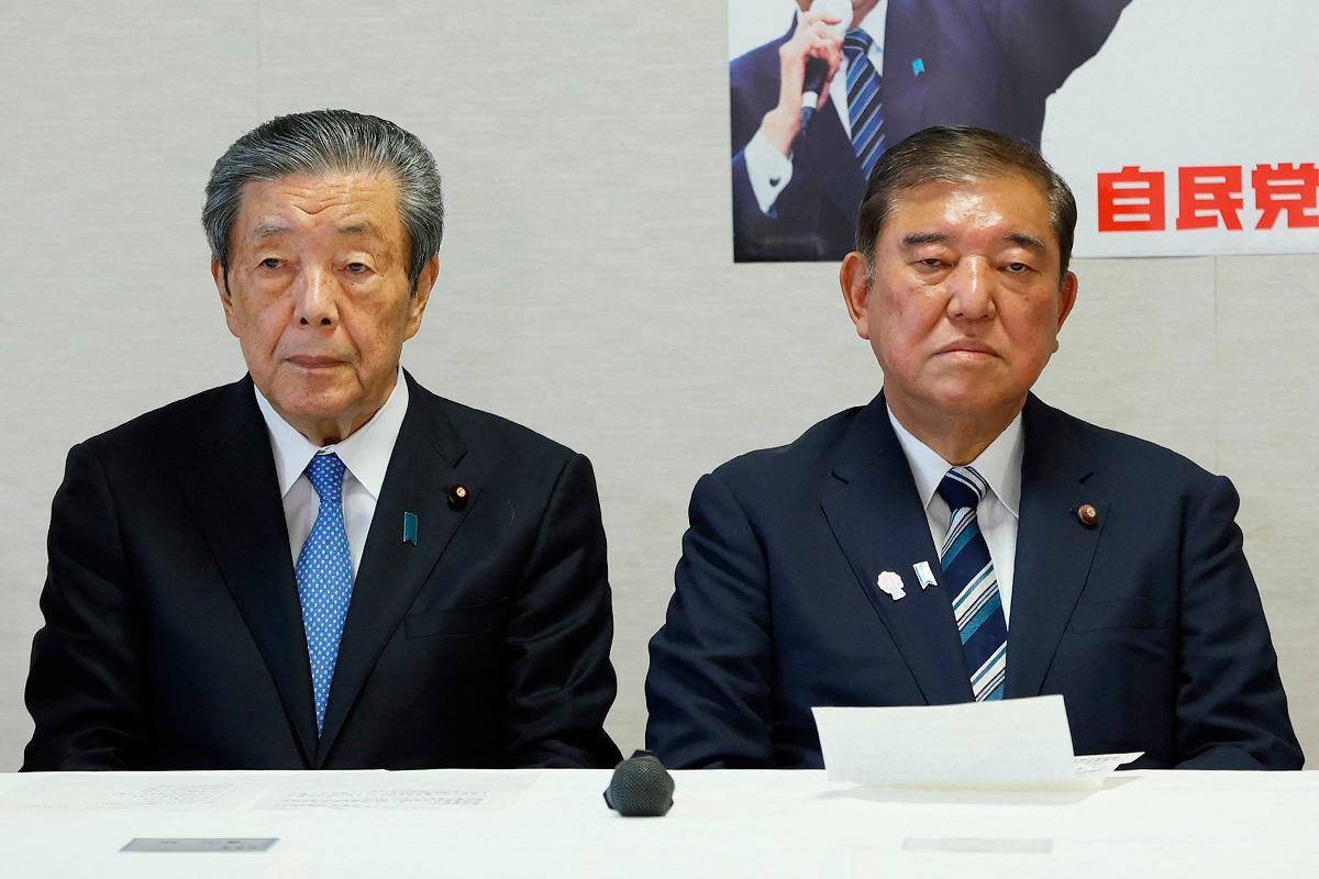 Japan’s Prime Minister Shigeru Ishiba (R) and secretary-general Hiroshi Moriyama (L) attend a meeting of the Liberal Democratic Party (LDP) executive committee at the party’s headquarters in Tokyo on September 2, 2025. - JIJI PRESS / AFP