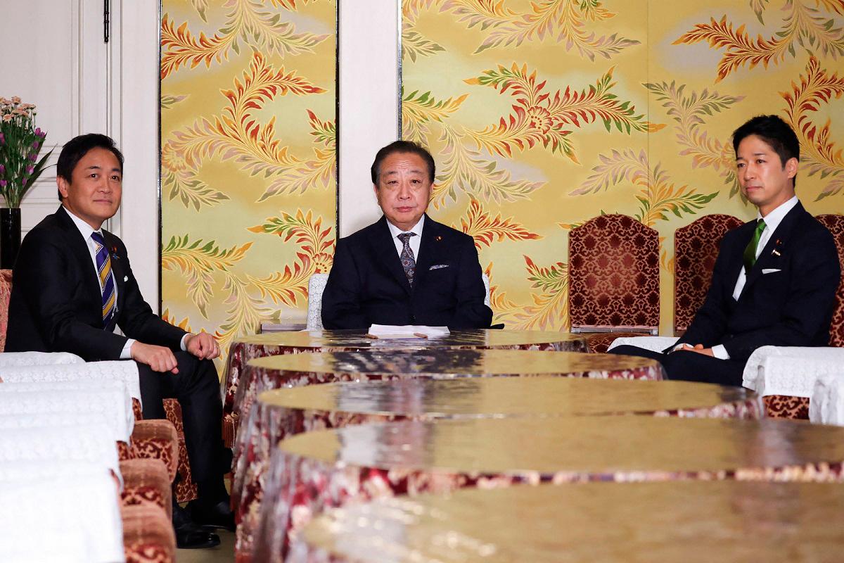 Leaders of three major Japanese opposition parties, leader of the Democratic Party for the People Yuichiro Tamaki (L), head of the largest opposition Constitutional Democratic Party of Japan Yoshihiko Noda (C) and co-leader of the Japan Restoration Party Fumitake Fujita, attend a meeting in the Diet in Tokyo on October 15, 2025. - JIJI PRESS / AFP