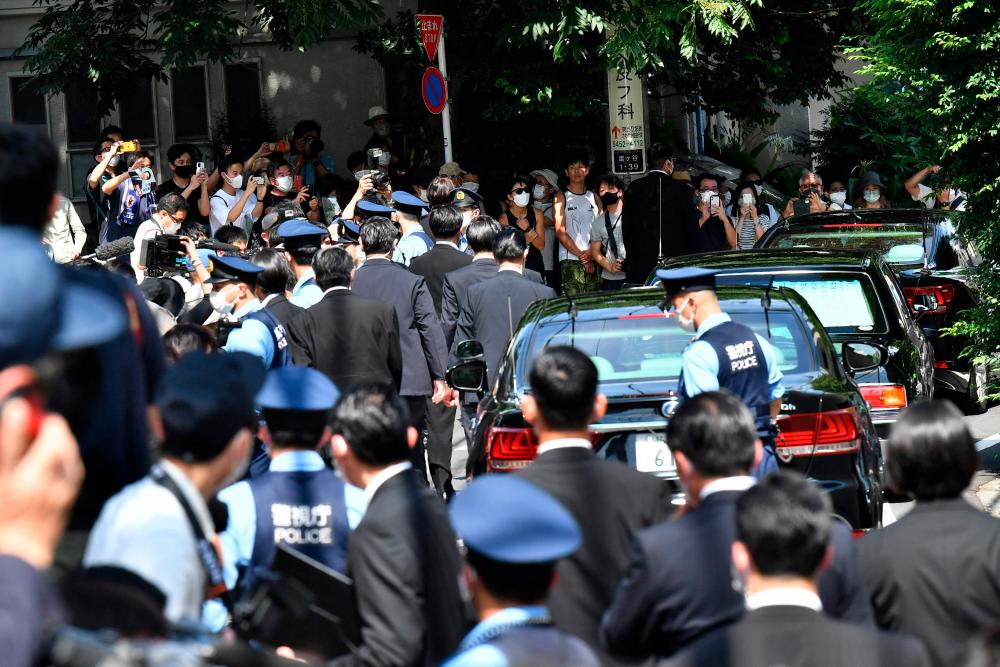People gather near the residence of former Japanese prime minister Shinzo Abe in Tokyo on July 9, 2022. AFPPIX