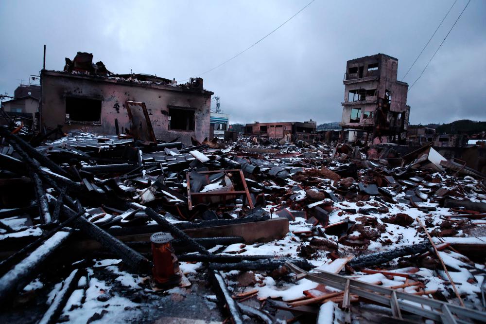 Snow covers the burnt ruins of Wajima morning market in the city of Wajima, Ishikawa prefecture on January 7, 2024, after a major 7.5 magnitude earthquake struck the Noto region in Ishikawa prefecture on New Year’s Day/AFPPix