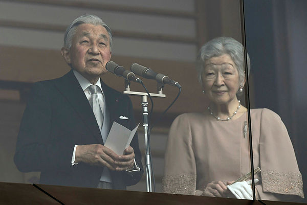 Japan’s Emperor Akihito delivers a speech while greeting wellwishers on his birthday beside Empress Michiko at the Imperial Palace on Dec 23, 2018. — AFP