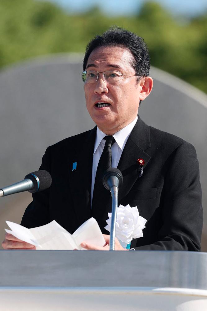 Japan's Prime Minister Fumio Kishida gives a speech during a ceremony to mark the 78th anniversary of the world's first atomic bomb attack, at the Peace Memorial Park in Hiroshima on August 6, 2023. - AFPPIX