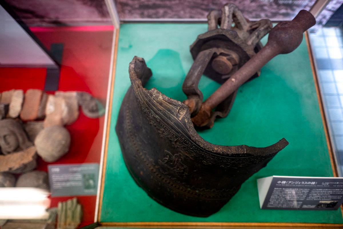 This picture taken on August 8, 2025 shows part of the tower bell (bell of the Angelus), which was destroyed by the atomic bomb, at the atomic bomb relics exhibition room of Urakami Cathedral in Nagasaki city. AFPPix