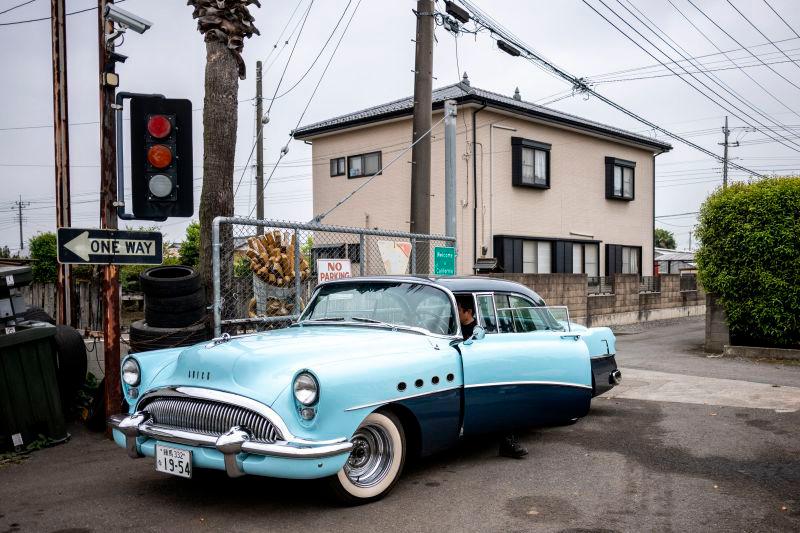 This picture taken on April 25, 2025 shows Yosuke Fukuda, the owner of US car dealer Y-Tech, driving a 1954 Buick Roadmaster from his company in Fukaya of Saitama Prefecture. AFPpix