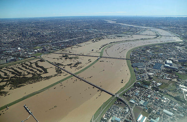 This aerial view shows the swollen Arakawa river in the aftermath of Typhoon Hagibis dividing Tokyo and Saitama prefecture on October 13, 2019. — AFP