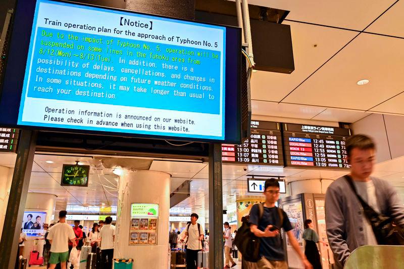 A digital sign alerting passengers of possible delays in northern Japan - due to “Typhoon No. 5”, now classified as Severe Tropical Storm Maria - is pictured at an entrance to Japan Rail (JR) at Tokyo Station - AFPpix