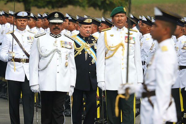 Sultan of Johor, Sultan Ibrahim Almarhum Sultan Iskandar (in black) greets the parade of honour while attending his official birthday ceremony at the Dewan Singgahsana Istana Besar on March 23, 2019. — Bernama