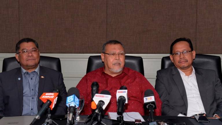 Johor PH has appointed state Amanah chairman Aminolhuda Hassan (C) during a press conference on Feb 26, 2020. — Bernama