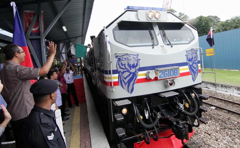 Sultan of Johor Sultan Ibrahim Almarhum Sultan Iskandar drives a special train locomotive train named ‘Blue Tiger’ during the second day of the Johor Mahkota Tour (KMJ) 2018, on Nov 27, 2018. — Bernama