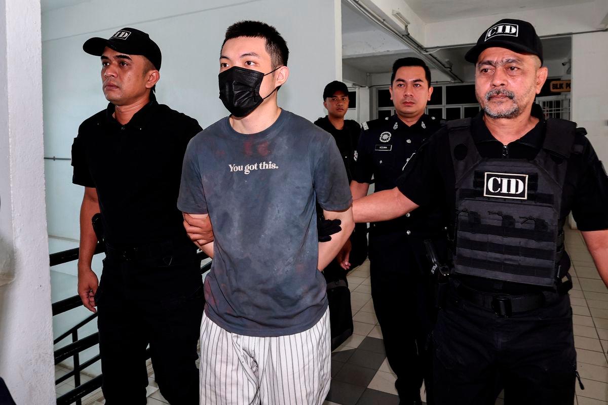 Law student at a private university, Chew Hong Joe (second from left), was brought to the Sessions Court here today on five charges of committing mischief by fire and one charge of causing the death of a senior citizen last July. – BERNAMA