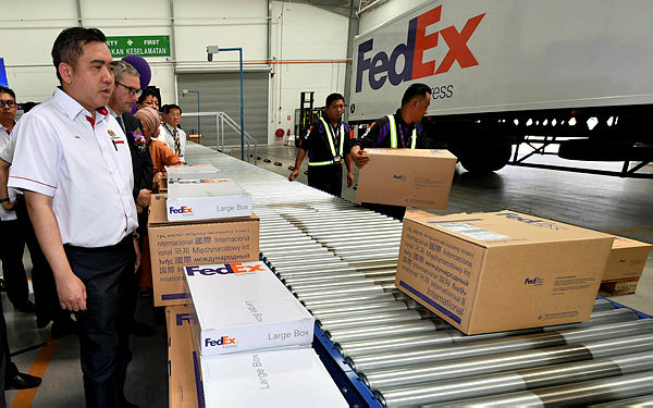 Transport Minister Anthony Loke inspects the operation of the newly launched Fedex Johor Station in Kulai on April 18, 2019. — Bernama