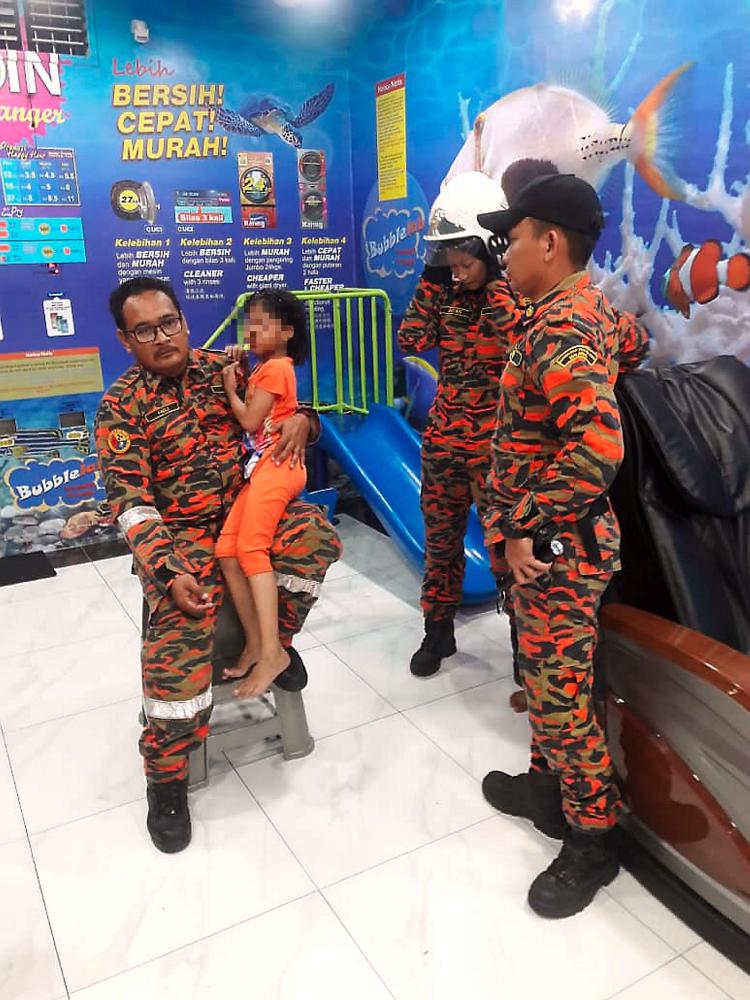 A nine-year-old girl is traumatized after being trapped in an automatic washing machine at a self-service laundry shop in Taman Larkin Perdana, last night. - Bernama