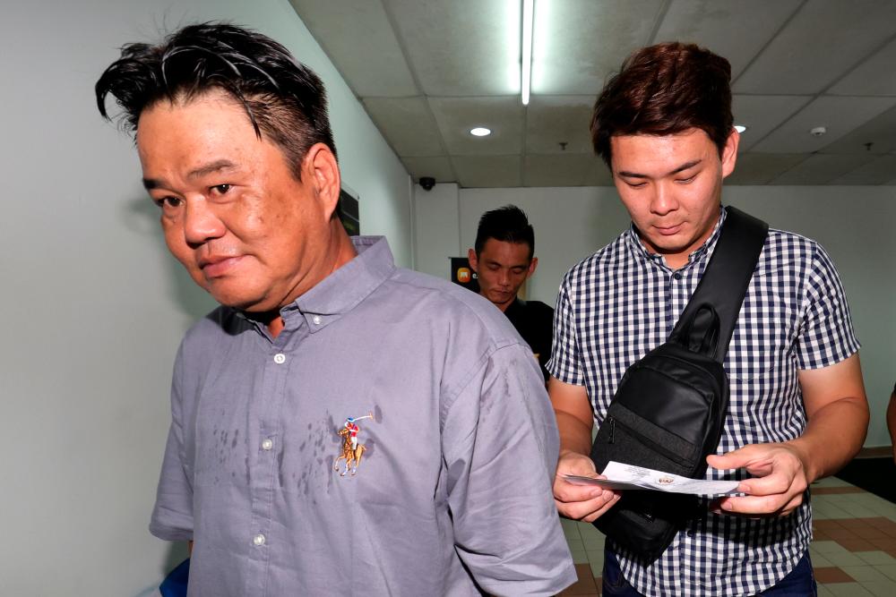 Tan Hock Lai, 45, (tengah) dan Chia Vui Chan, 30, (kanan) mengaku bersalah di hadapan Hakim Datuk Che Wan Zaidi Che Wan Ibrahim sementara Wong Wai Heng, 47, (kiri)/BERNAMAPix