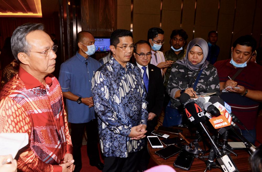 International Trade and Industry Minister Datuk Seri Mohamed Azmin Ali and Johor Mentri Besar Datuk Ir Hasni Mohammad (L) were met by members of the media after attending an industry roundtable discussion in Johor Baru today. - Bernama