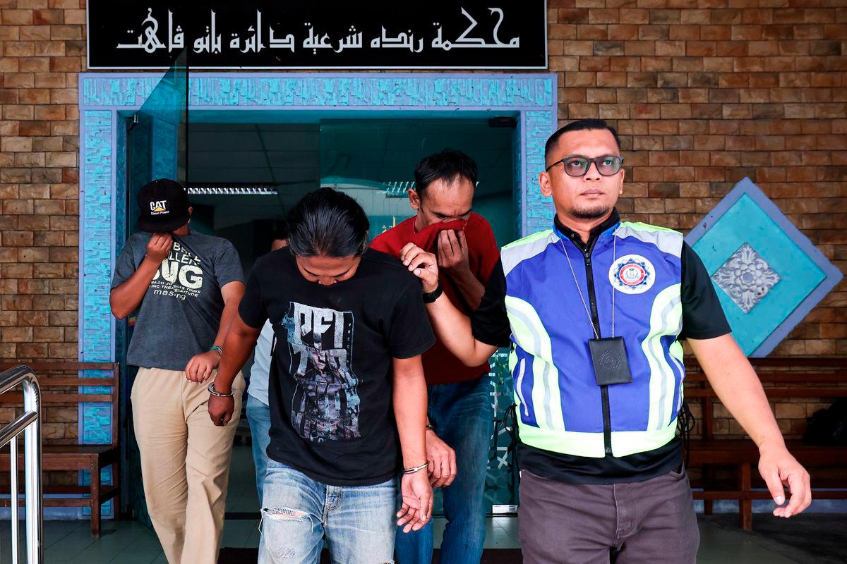 Three men (from left), Muhammad Suhail Suttrysono, 35, Anuar Bandi, 40, and Azman Mohamed Seh, 45, pleaded guilty at the Syariah Court here today to charges of being involved in a worship ceremony linked to the viral video “Show Puja Jin Batu Pahat,“ which featured the kuda kepang dance in Parit Raja here three weeks ago. - BERNAMA