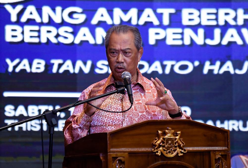 Prime Minister Tan Sri Muhyiddin Yassin delivering a speech during a town hall session with the Johor state civil servants today. - Bernama