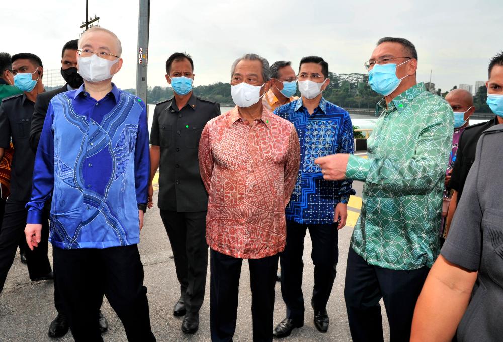 Prime Minister Tan Sri Muhyiddin Yassin accompanied by Foreign Minister Datuk Seri Hishammuddin Tun Hussein after the agreement to proceed with the Rapid Transit System (RTS) project between Singapore and Johor Baharu today. — Bernama