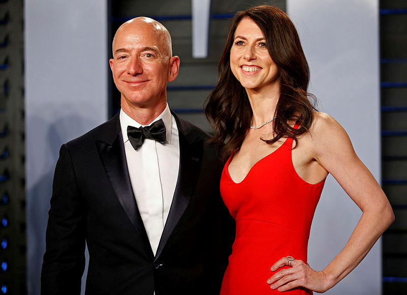 Filepix of Amazon CEO Jeff Bezos (L) and MacKenzie Bezos, arriving for the Vanity Fair Oscar Party, on March 4, 2018. — Reuters