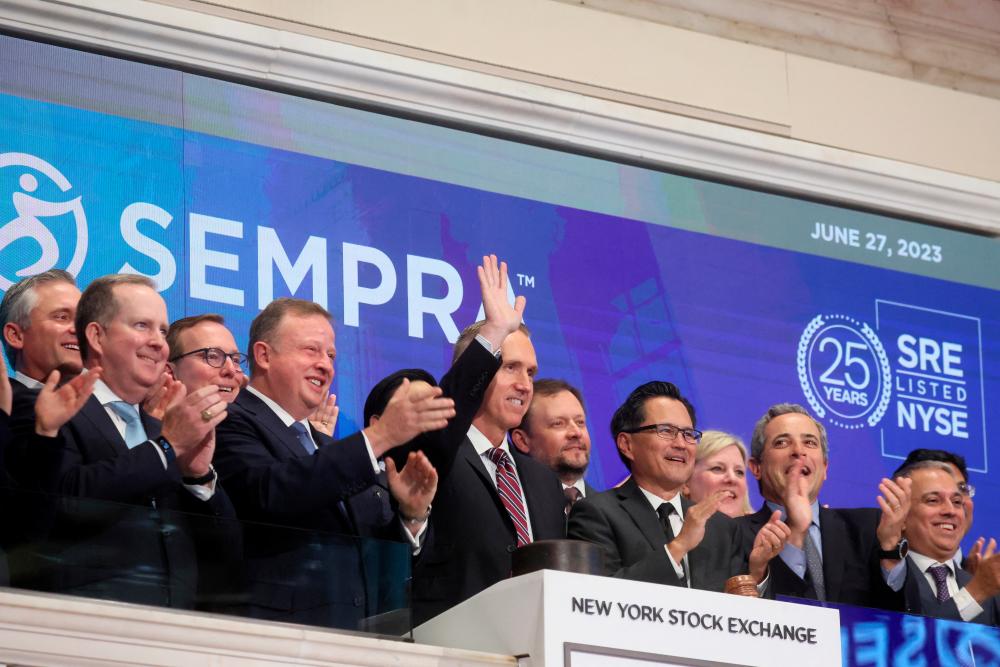 Jeff Martin, chairman and CEO of Sempra, rings the opening bell at the New York Stock Exchange on Tuesday, June 27, 2023. – Reuterspic