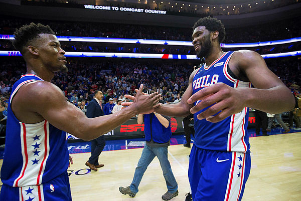 Philadelphia 76ers guard Jimmy Butler (23) and center Joel Embiid (21) celebrate a victory against the Boston Celtics at Wells Fargo Center. — Reuters