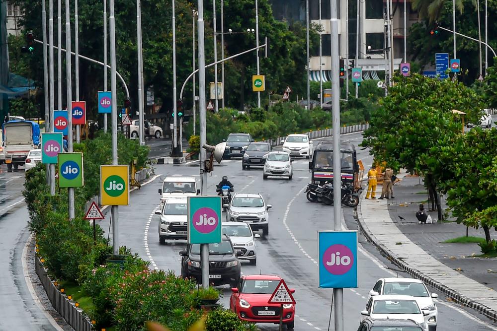 Signboards of Indian digital services company Jio, a subsidiary of Reliance, on a road in Mumbai today. – AFPPIX