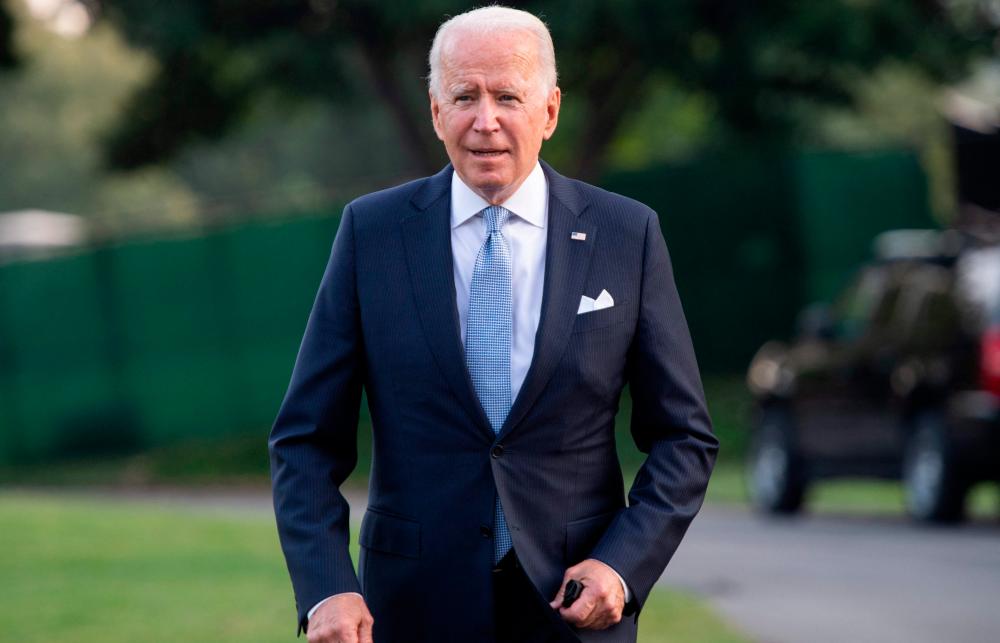 US President Joe Biden walks to Marine One prior to departure from the South Lawn of the White House in Washington, DC, July 29, 2021, as he travels to Walter Reed National Military Medical Center in Maryland where First Lady Jill Biden is having a medical procedure. -AFP