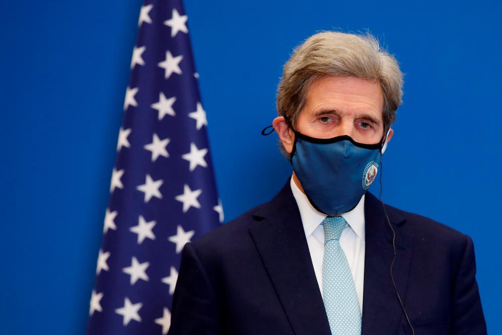 US Special Presidential Envoy for Climate John Kerry attends a joint news conference with French Economy and Finance Minister Bruno Le Maire (not seen) after a meeting at the Bercy Finance Ministry in Paris, France, March 10, 2021. REUTERSpix