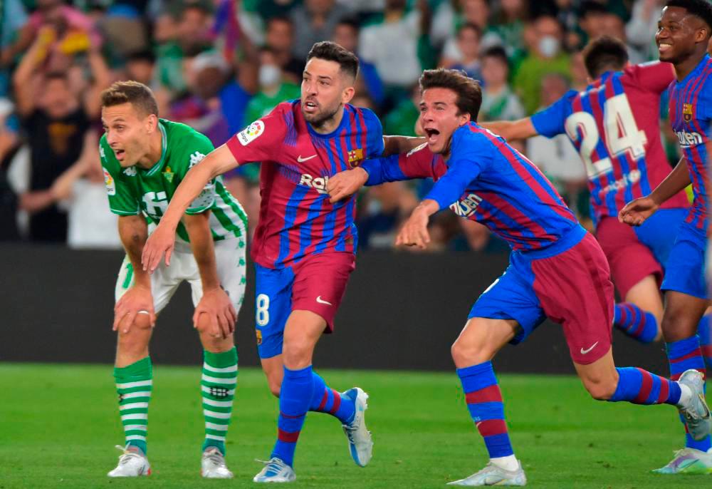 Jordi Alba celebrates after scoring a goal during the Spanish League football between Real Betis and FC Barcelona at the Benito Villamarin stadium in Seville on May 7, 2022. AFPpix