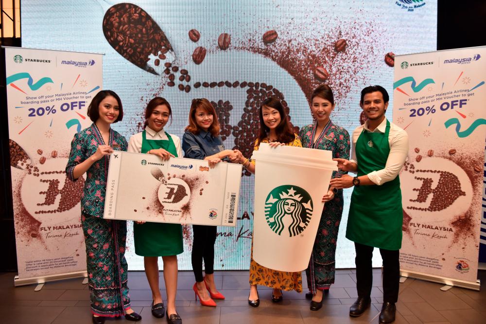 (third from left) Starbucks head of marketing &amp; loyalty Thila Chandran and Lau at the launch event.
