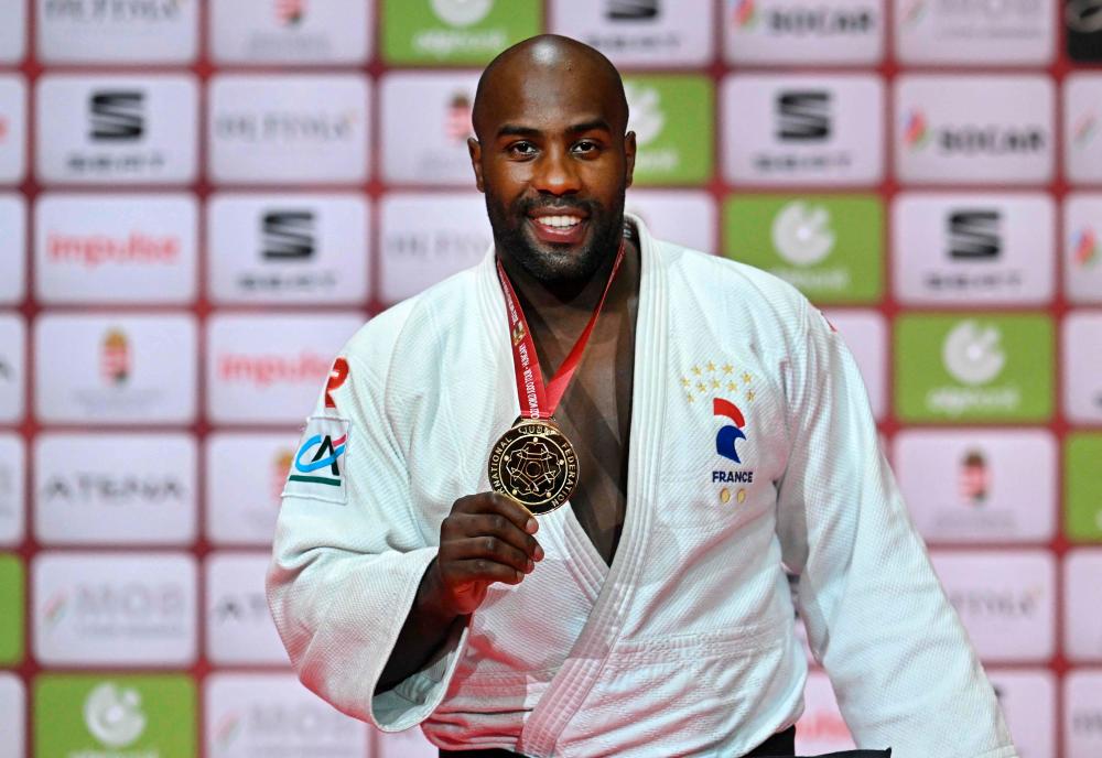 Gold medalist France’s Teddy Riner shows his medal on the podium after the men’s +100kg weight category final during the Grand Slam Judo Championship in Papp Laszlo Arena of Budapest, Hungary on July 10, 2022. AFPPIX