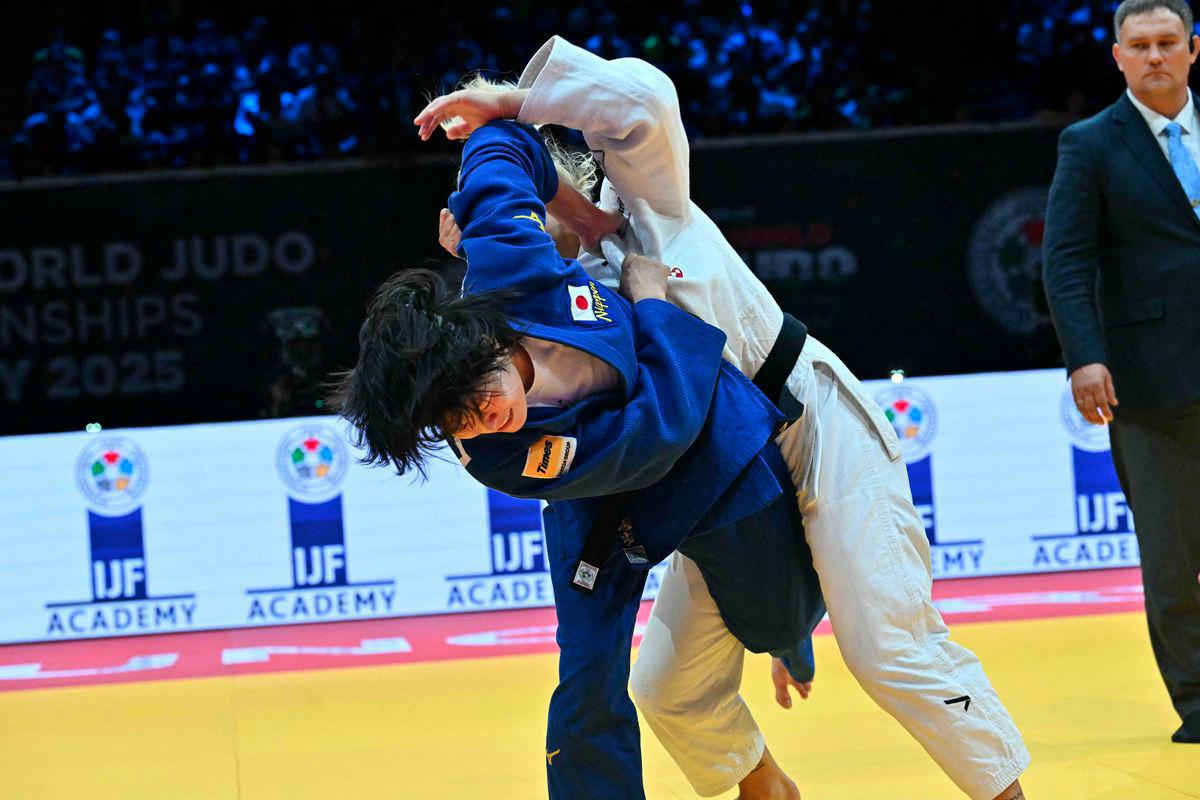 Japan's Shiho Tanaka (blue) competes against Croatia's Lara Cvjetko during the women's -70kg fianl bout of the Judo World Championships at the Papp Laszlo Arena in Budapest, Hungary, on June 17, 2025. - AFPPIX