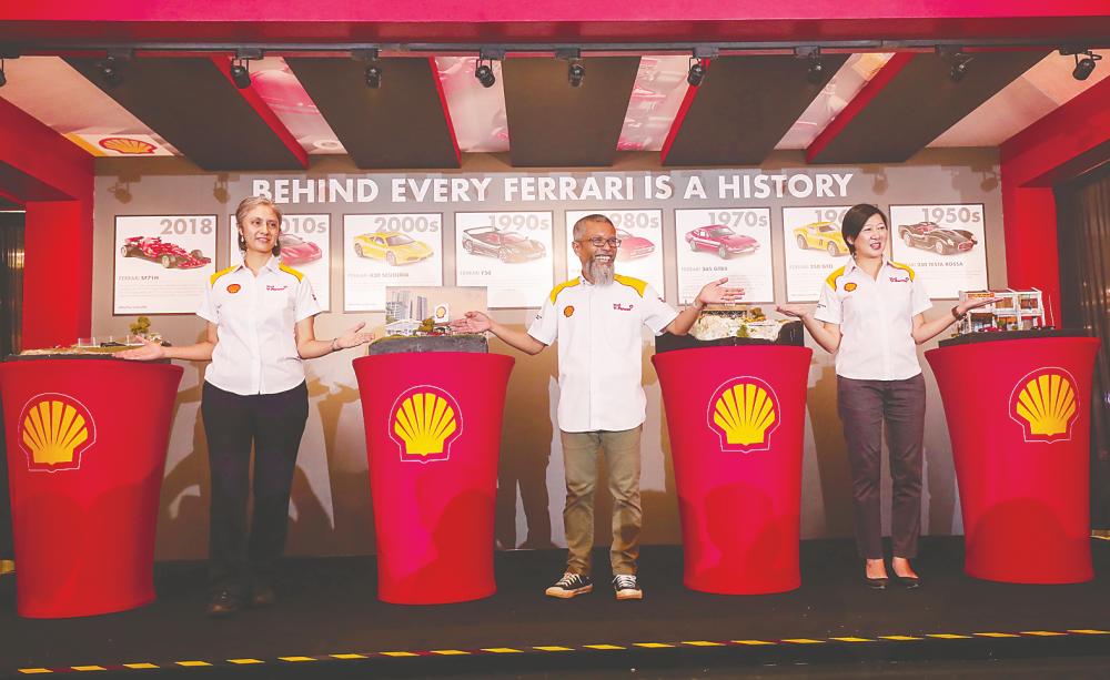(From left) Zharin, Shairan and Shell Head of Retail Marketing Chung Ai Kee introduce Shell ShowVroom at the launch. - SUNPIX/Ashraf Shamsul