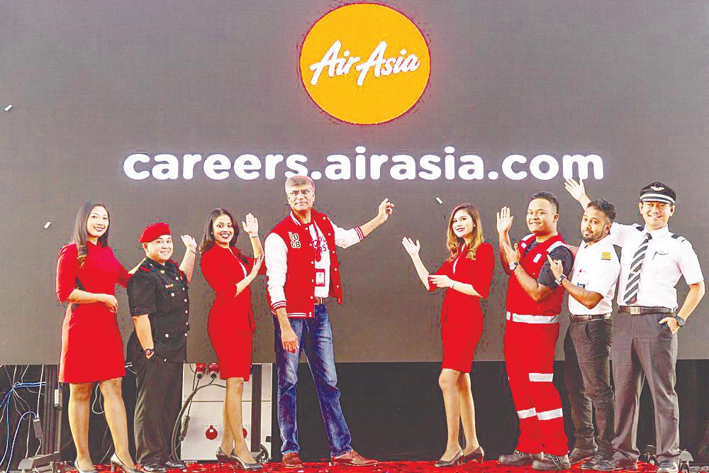 Bhatia (centre) with AirAsia Allstars at the launch of the airline’s new career website at RedQ in Sepang.