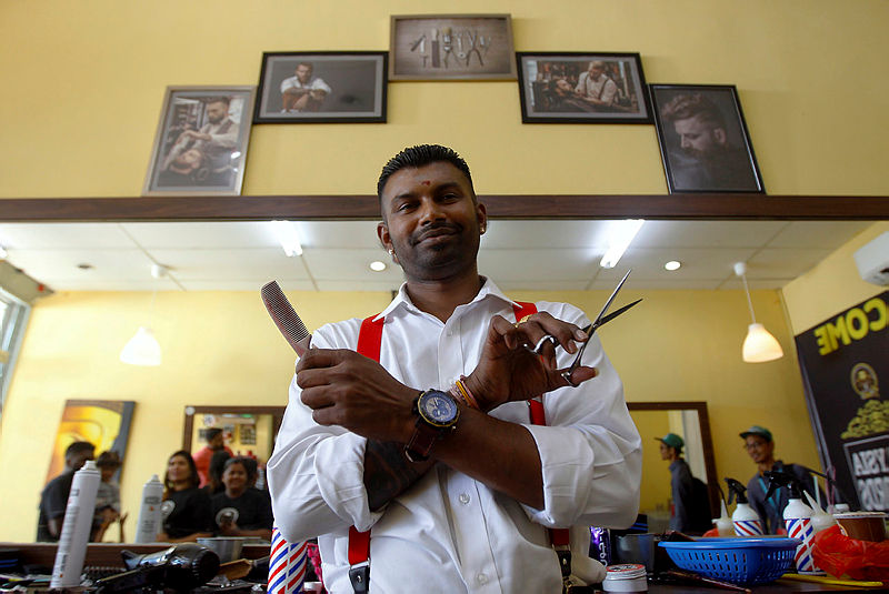 S. Kalitasan poses for a photo at his shop, on May 1, 2019. — Bernama