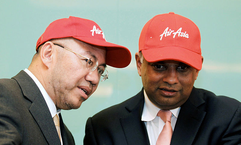 Filepix of Datuk Kamarudin Meranun and Tan Sri Tony Fernandes. — Reuters