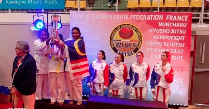 The Malaysian team celebrate their medal haul at the international open karate tournament in Lyon, France, recently. IOSSKAM handout pic
