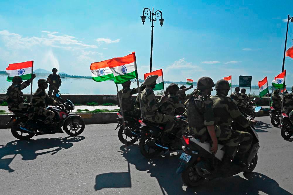 Indian Border Security Force (BSF) soldiers take part in a motorbike rally as part of the celebrations to mark the 75th anniversary of country’s independence during ‘Har Ghar Tiranga’ campaign in Srinagar on August 10, 2022. - AFPPIX