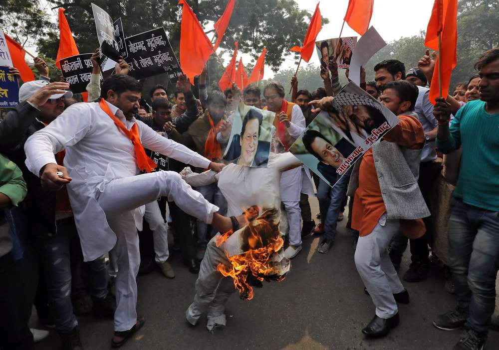 Activists from Hindu Sena, burn an effigy depicting Pakistan’s Prime Minister Imran Khan during a protest against the attack on a bus that killed 44 police personnel in Kashmir, in New Delhi, India, on Feb 15, 2019. — Reuters