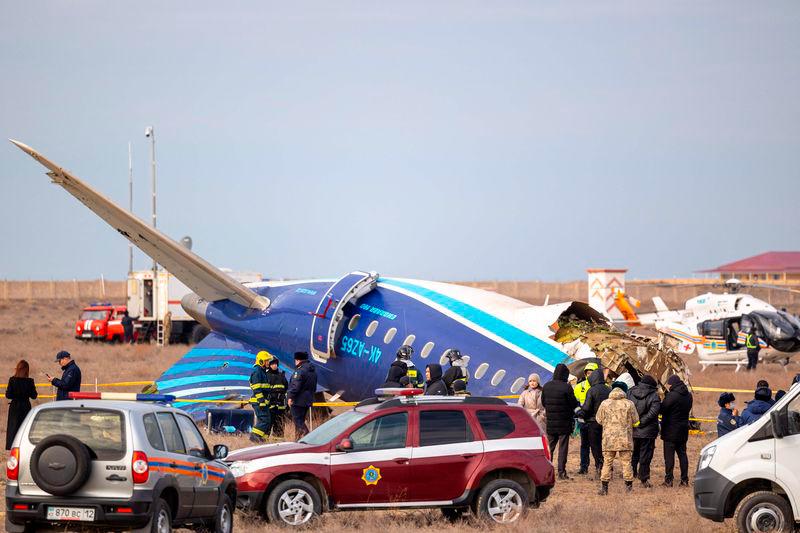 Emergency specialists work at the crash site of an Azerbaijan Airlines passenger jet near the western Kazakh city of Aktau on December 25, 2024. (Photo by Issa Tazhenbayev / AFP)