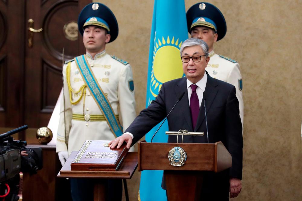 Kazakhstan's Senate chairman Kassym-Jomart Tokayev takes the oath as Kazakh interim president during a ceremony in Astana on March 20, 2019. — AFP