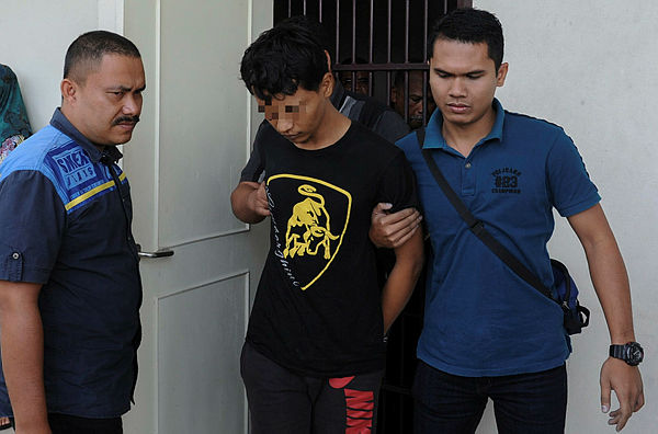 Noor Azlan Ismail, 32, was charged in the sessions court in Pasir Mas for the murder of a car cleaner in Kampung Simpang Empat Tok Darat in August of last year. — Bernama