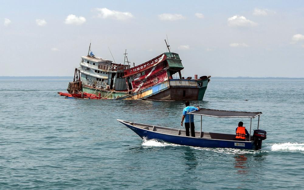 Two of four seized Vietnamese fishing boats sunk by the MMEA in the waters off Tumpat on March 5, 2019. — Bernama