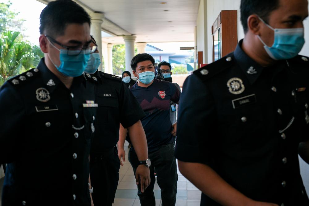 Despatch rider Omar Mat Khatib, 31, (C) was ordered to serve a three-months community service by the Alor Star magistrate’s court after pleading guilty to failing to provide information on his travel history. - Bernama