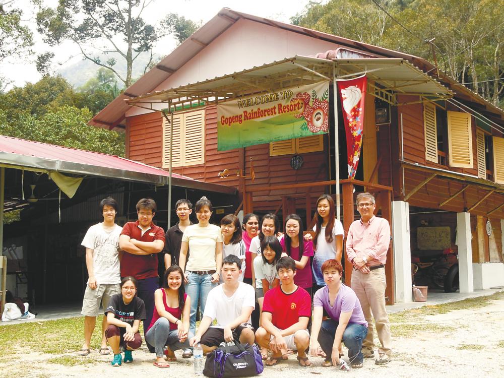 Lau (centre, in yellow) with her students during a field trip.