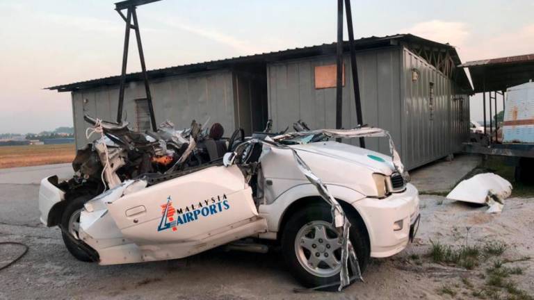 The wreckage of the car after the collision with a private aircraft at Sultan Abdul Aziz Shah Airport, Subang on March 18, 2019.