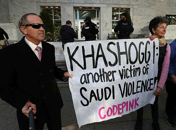 In this photo taken on Oct 25, 2018, protesters gather in front the Saudi Arabian Embassy as they call for justice in the killing of Saudi journalist Jamal Khashoggi, in Washington, DC. Rights groups pressed US President Donald Trump to take action over Saudi Arabia’s killing of dissident writer Jamal Khashoggi on the eve of a Feb 8, 2019 — AFP